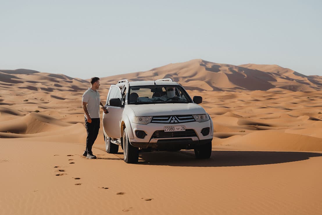 4WD vehicle exploring the desert landscape around Merzouga