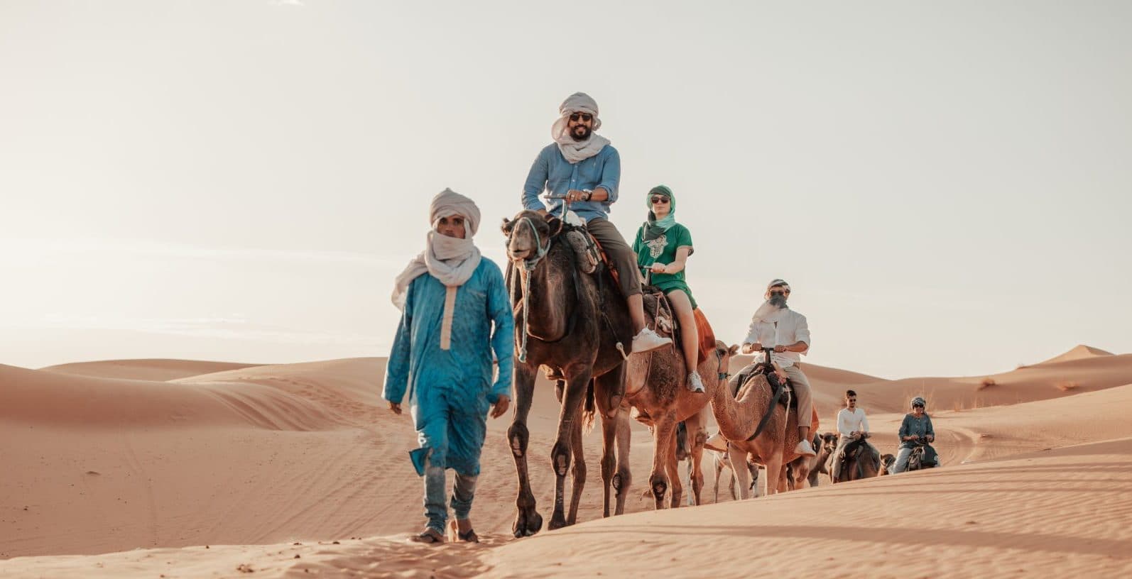 Camel and rider silhouetted against the Erg Chebbi dunes near Merzouga
