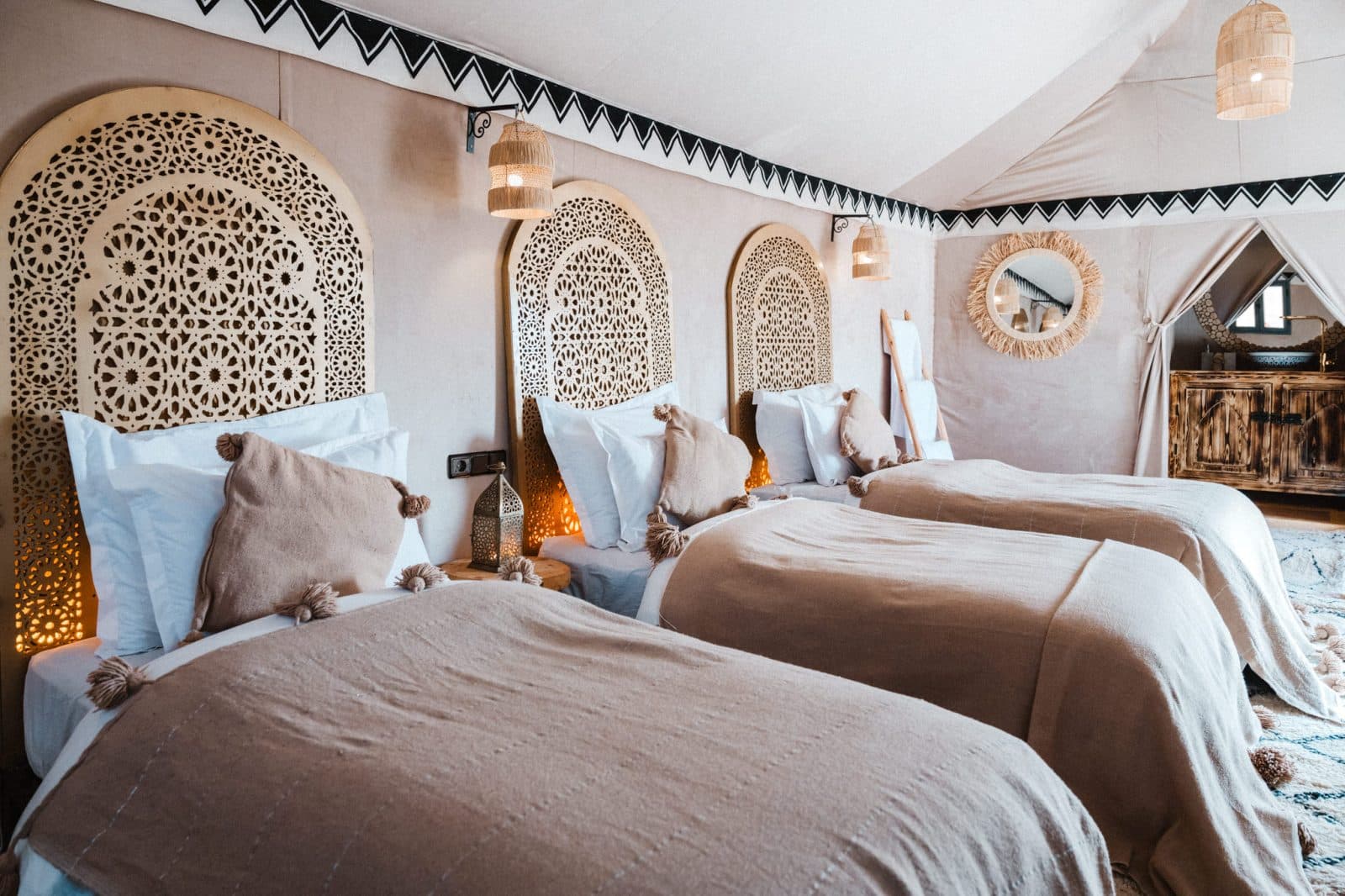 Tiziri tent interior with carved Moroccan headboards